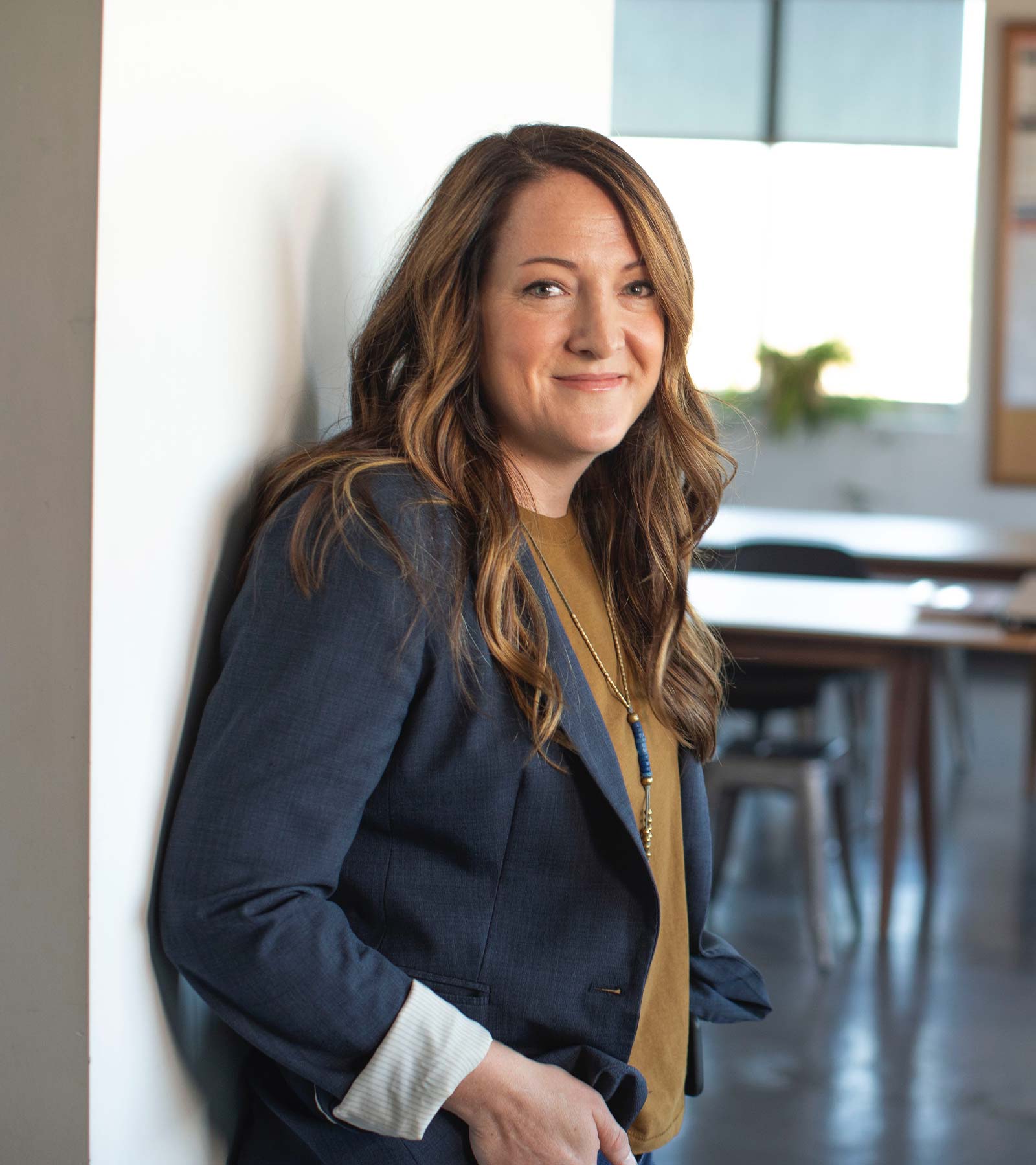 Woman Standing against Wall Smiling Woman Standing against Wall Smiling
